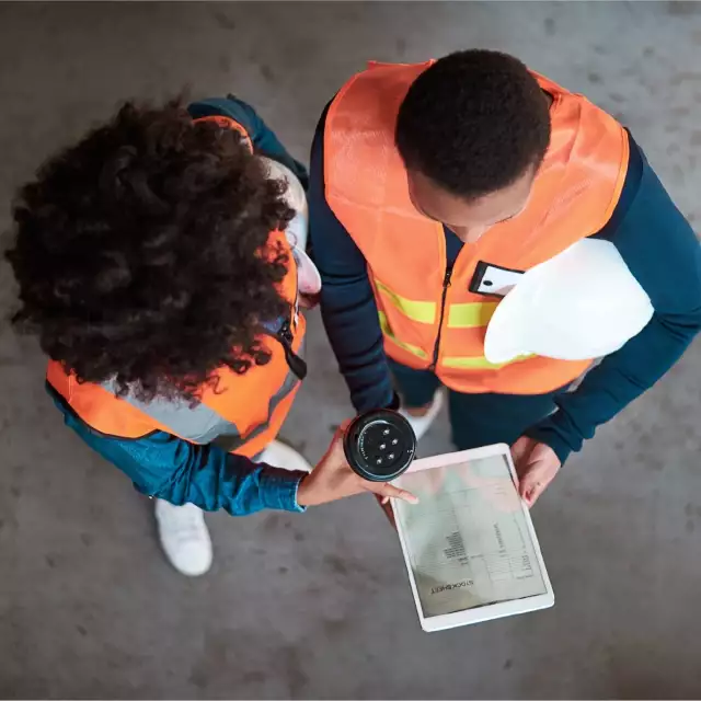 Two manufacturers looking at tablet