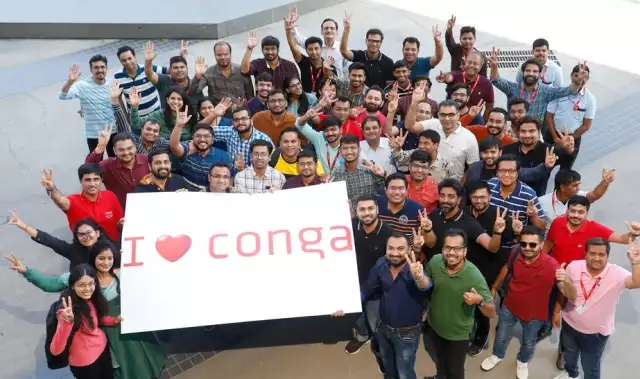 Conga employees holding a I love Conga sign