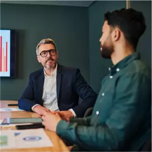 Two men forecasting revenue