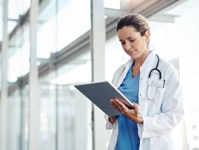 Doctor using iPad