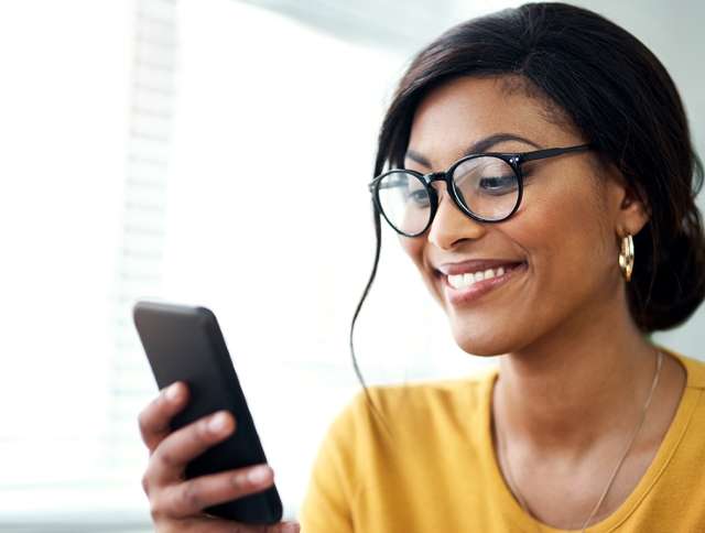 Woman smiling on cell phone