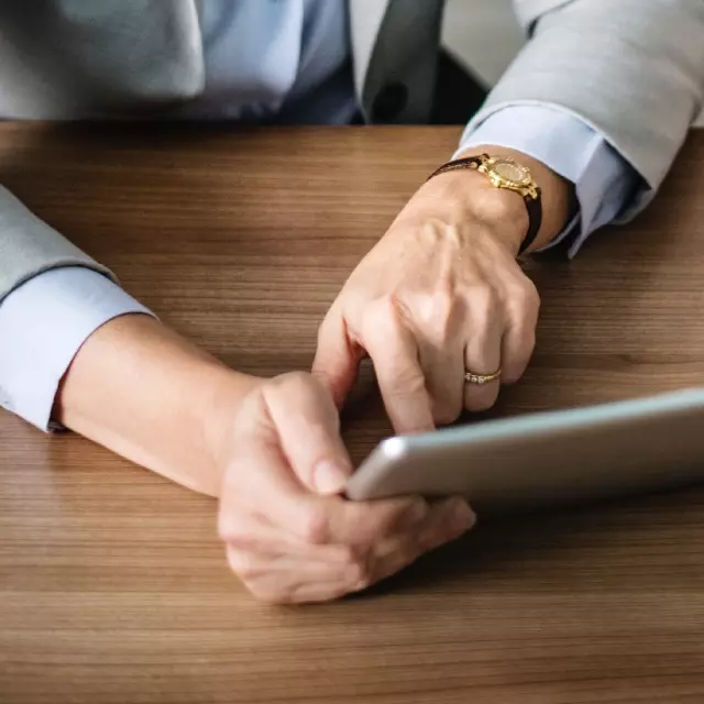 Woman using Conga Automate Revenue Suite on tablet