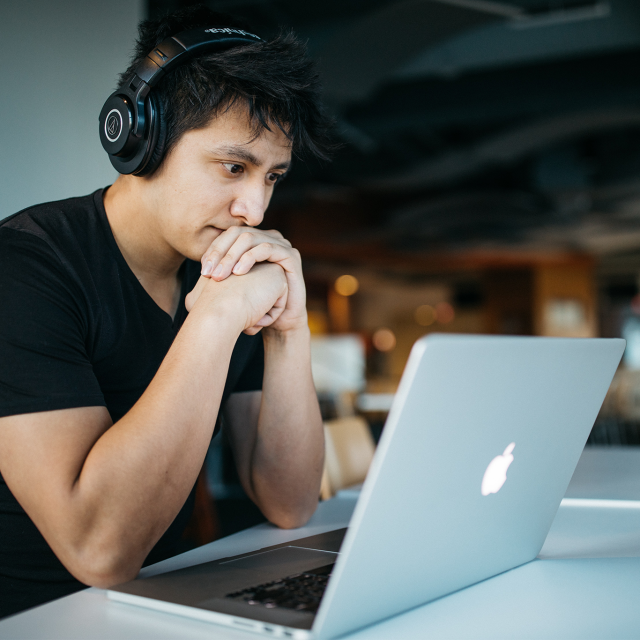 Man watching video on laptop