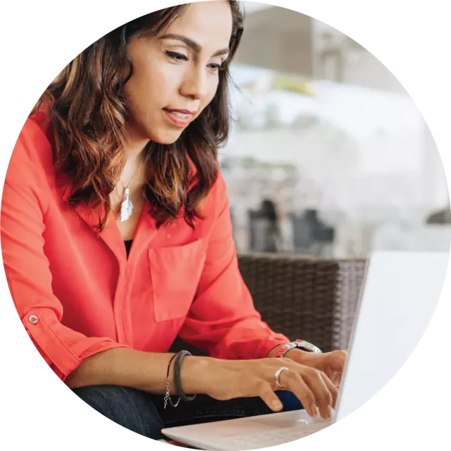 Woman typing on laptop