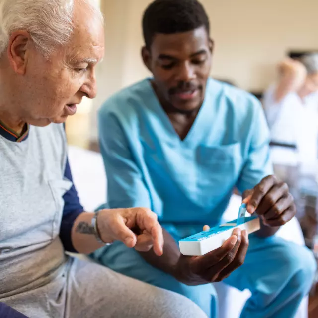 Nurse providing medication to patient