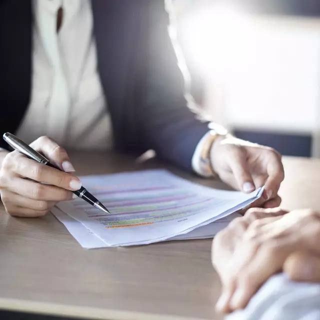 Two legal professionals reviewing a contract