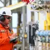 Manufacturing worker holding laptop